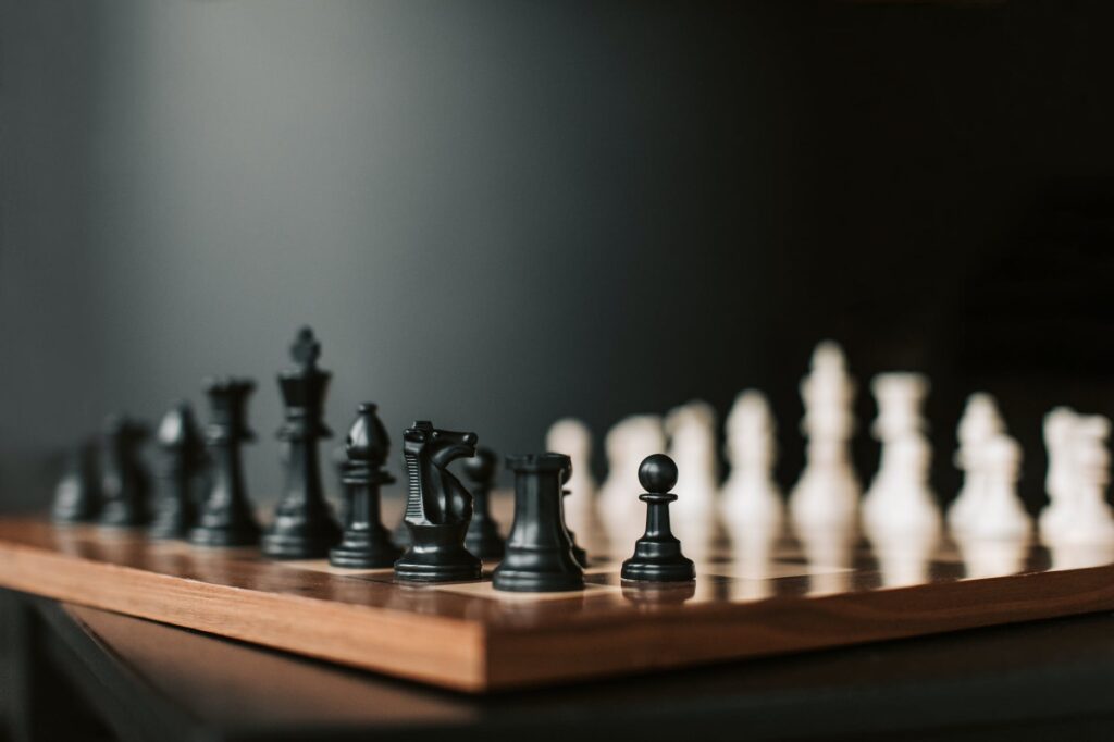 black and white chess pieces on chess board