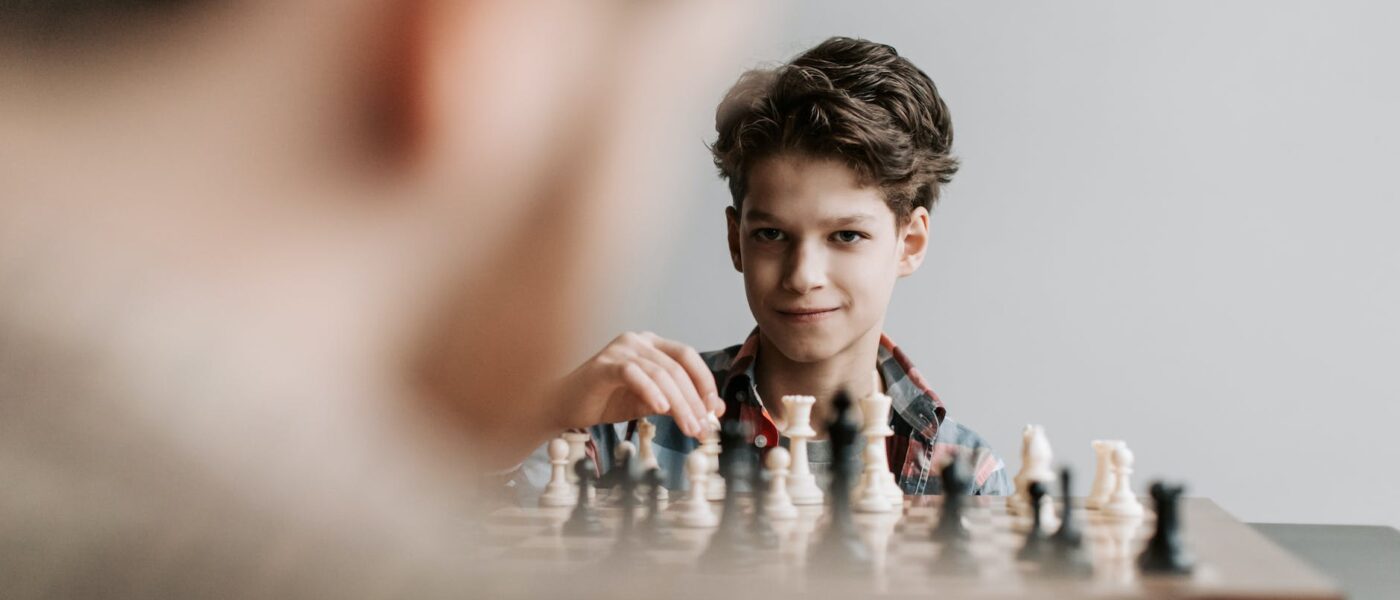 a boy playing chess