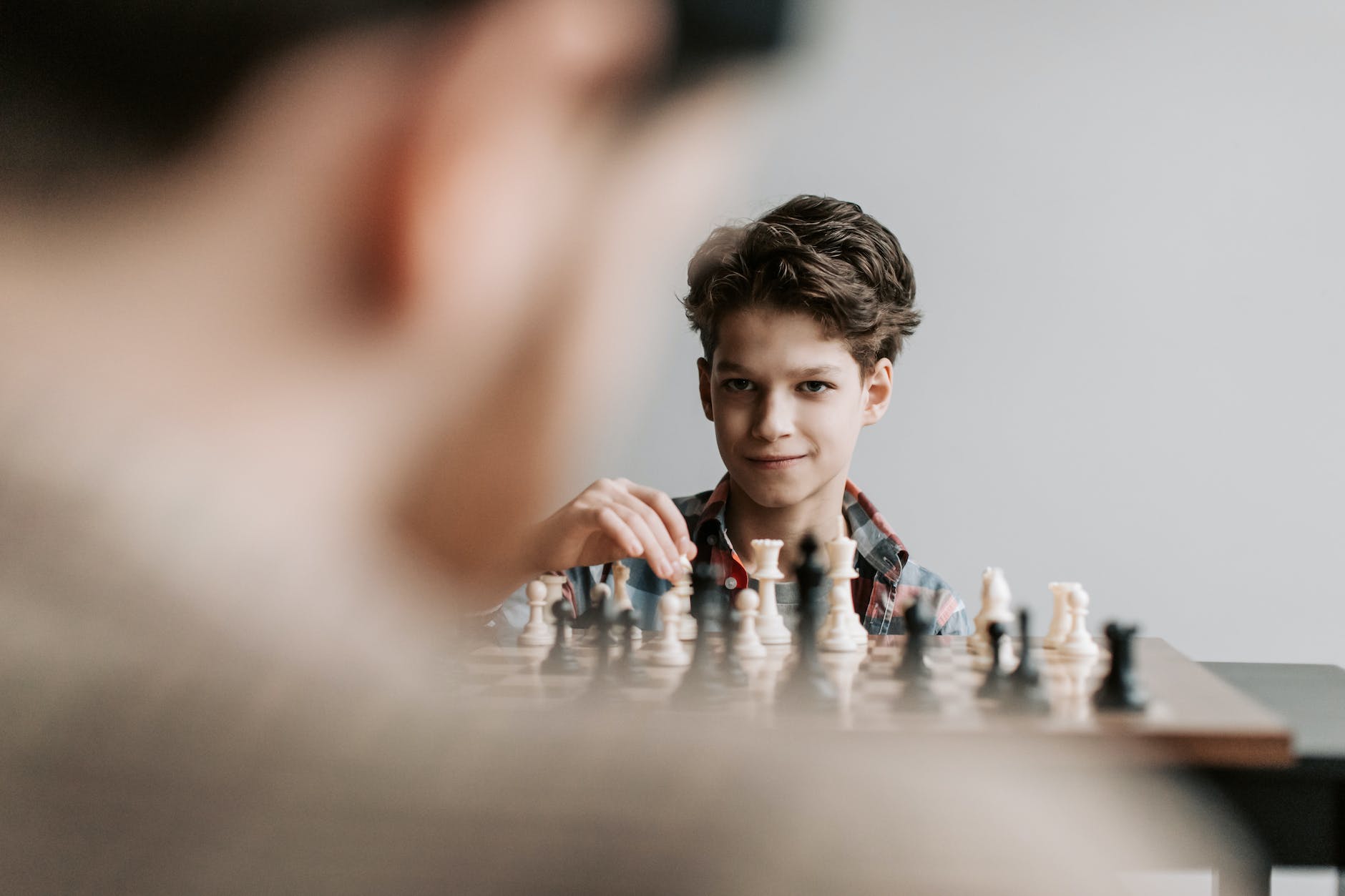 a boy playing chess